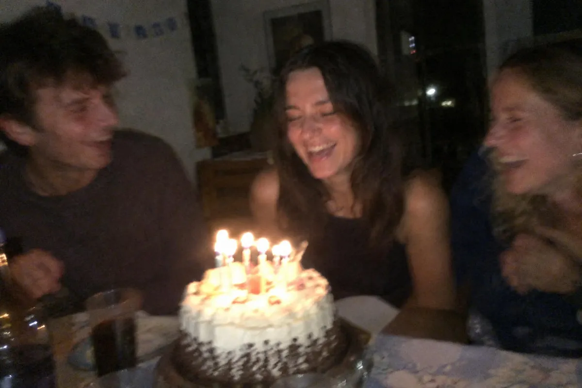 Before: Blurry, grainy low-light party photo sharpened and cleaned up