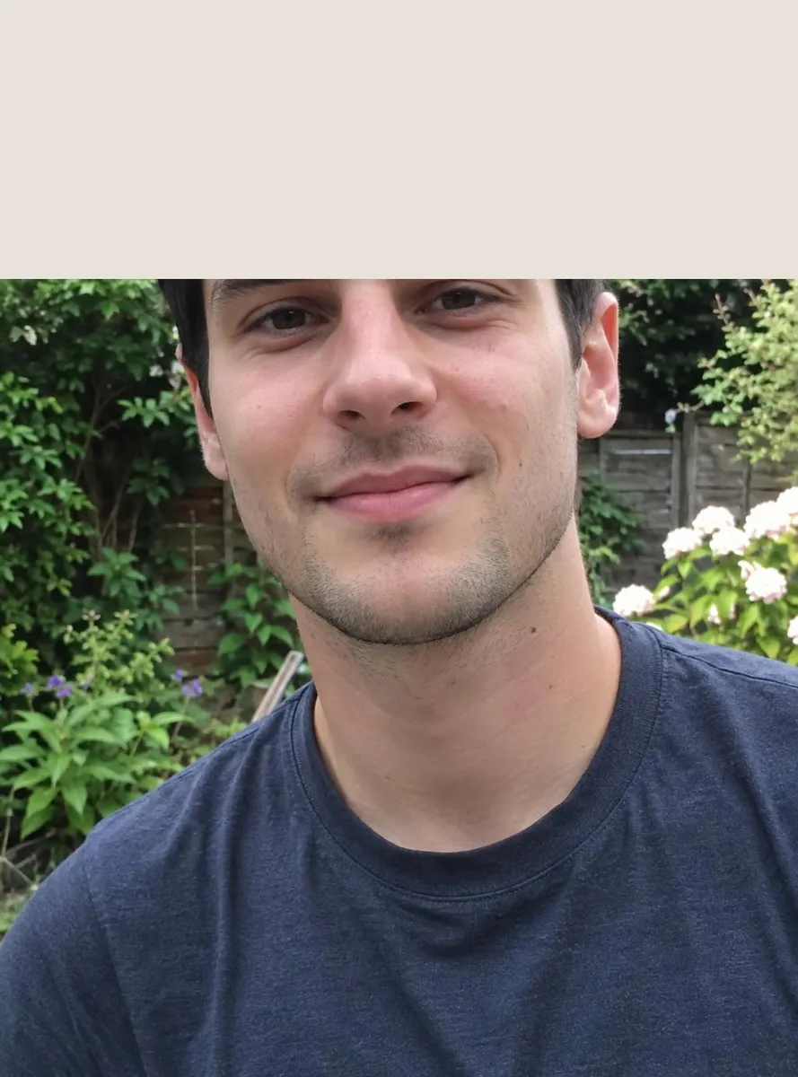 Before: Tightly cropped portrait extended upward to show the top of his head