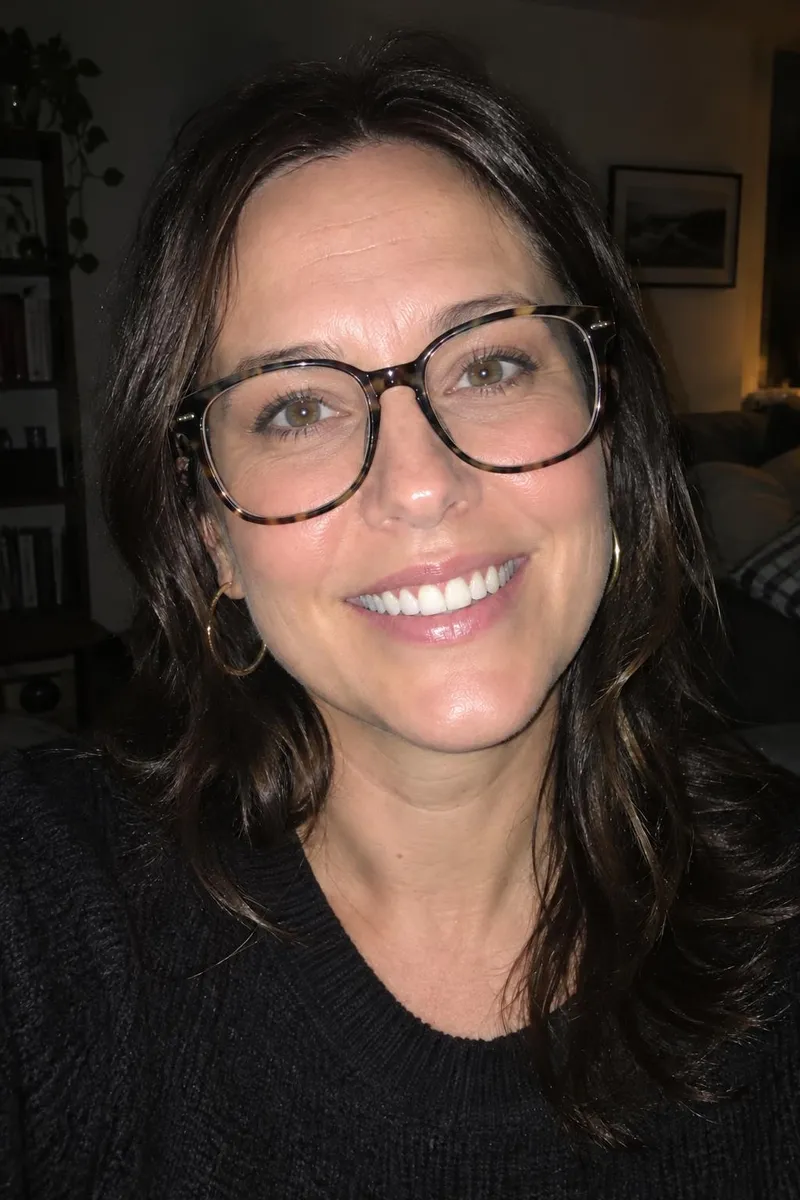 After: Portrait with the flash glare removed from her glasses