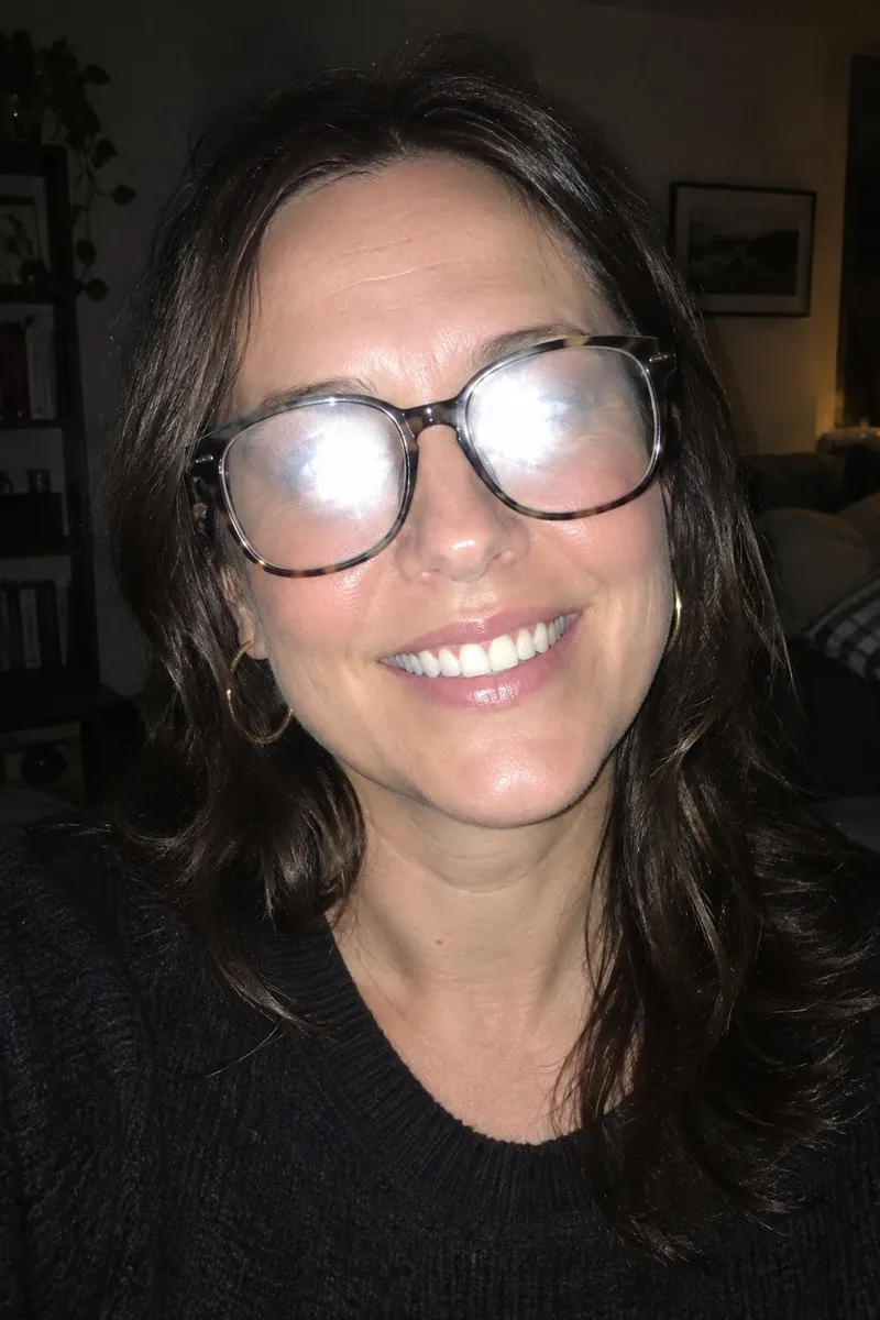 Before: Portrait with the flash glare removed from her glasses